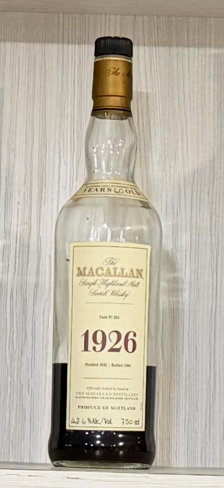 Seller's opened Macallan 1926 bottle with remaining liquid